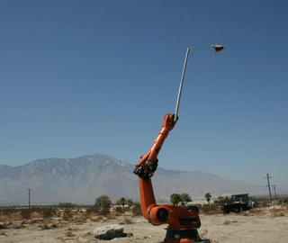 Illustration for article titled $70,000 Industrial Robot Modded to Fire Flameballs